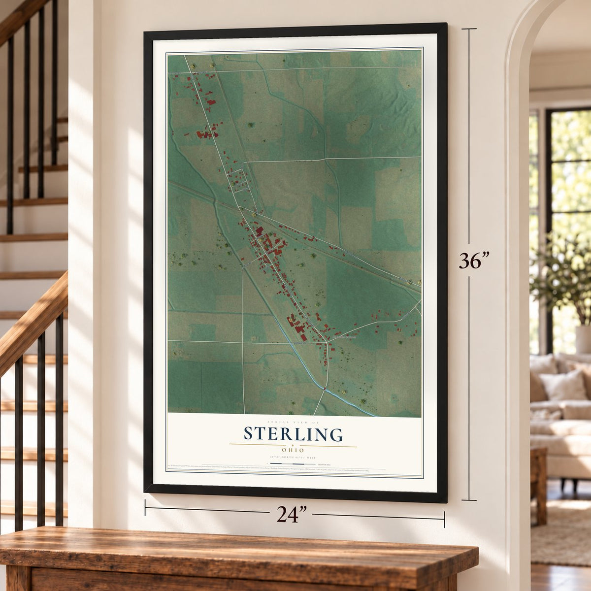Sterling, Ohio map, 24 x 36 inch print in a black frame by a staircase