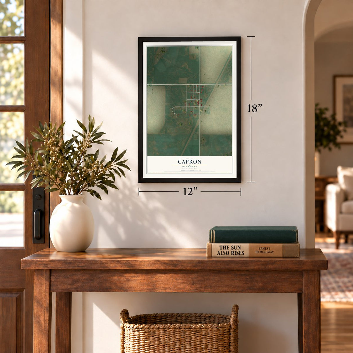 Capron, Oklahoma map, 12 x 18 inch print in a black frame in an entryway