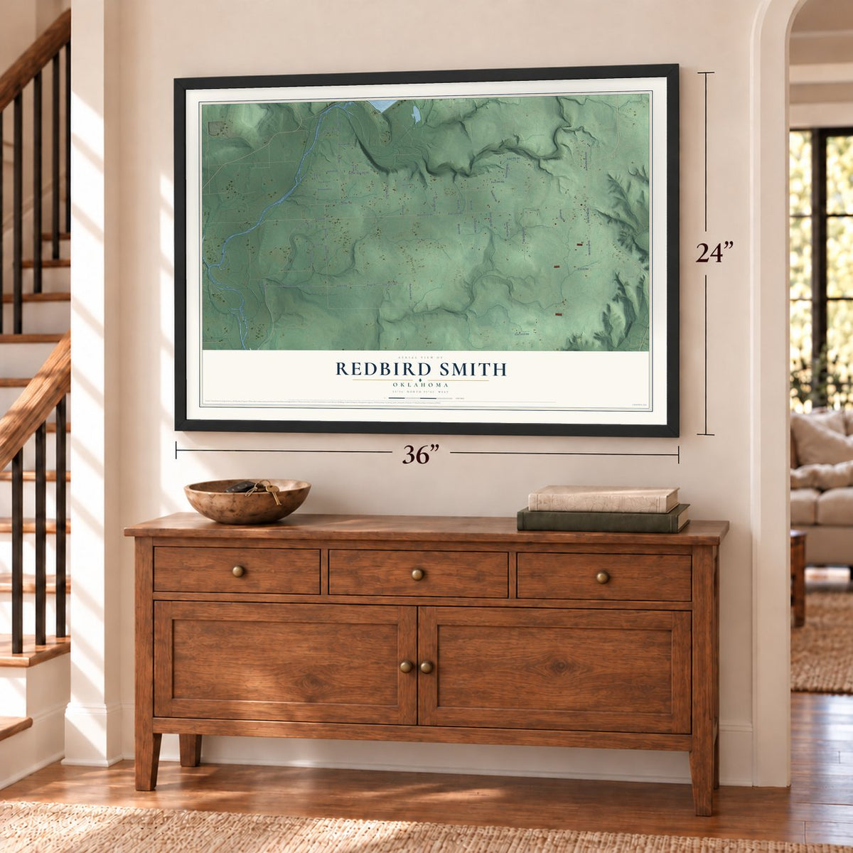 Redbird Smith, Oklahoma map, 24 x 36 inch print in a black frame above a dresser by a staircase
