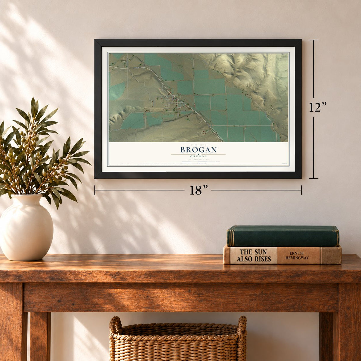 Brogan, Oregon map, 12 x 18 inch print in a black frame in an entryway