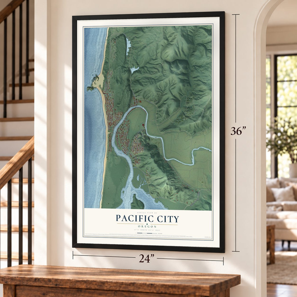 Pacific City, Oregon map, 24 x 36 inch print in a black frame by a staircase