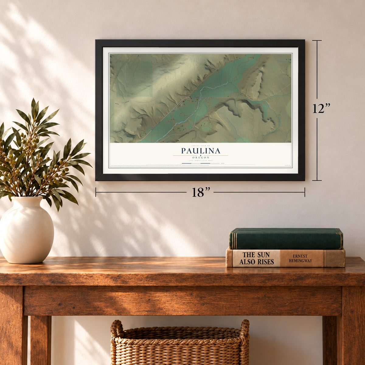 Paulina, Oregon map, 12 x 18 inch print in a black frame in an entryway