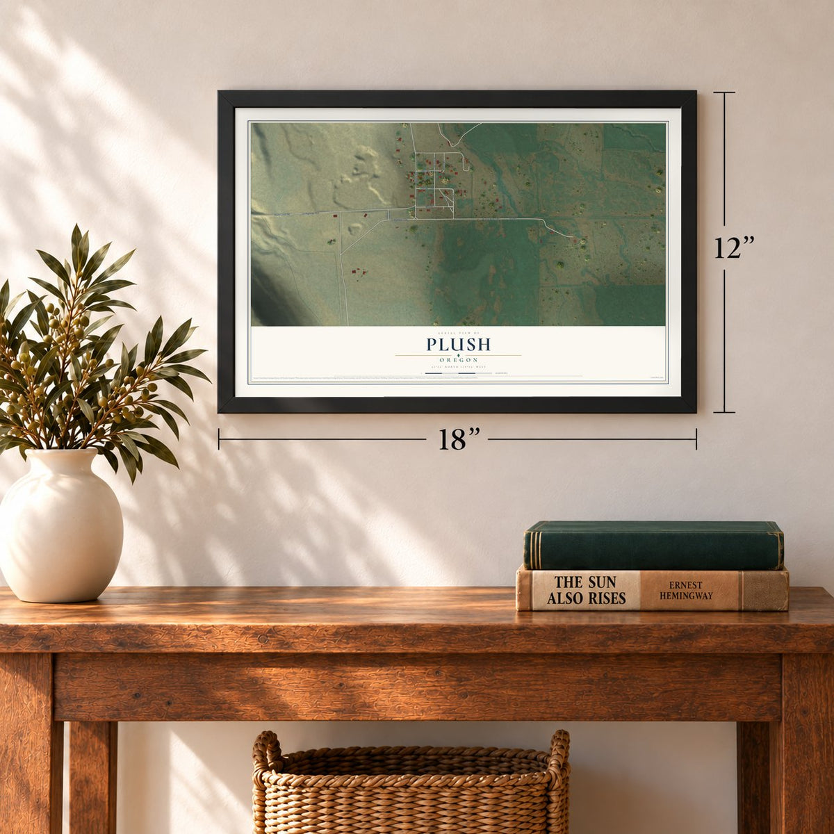Plush, Oregon map, 12 x 18 inch print in a black frame in an entryway