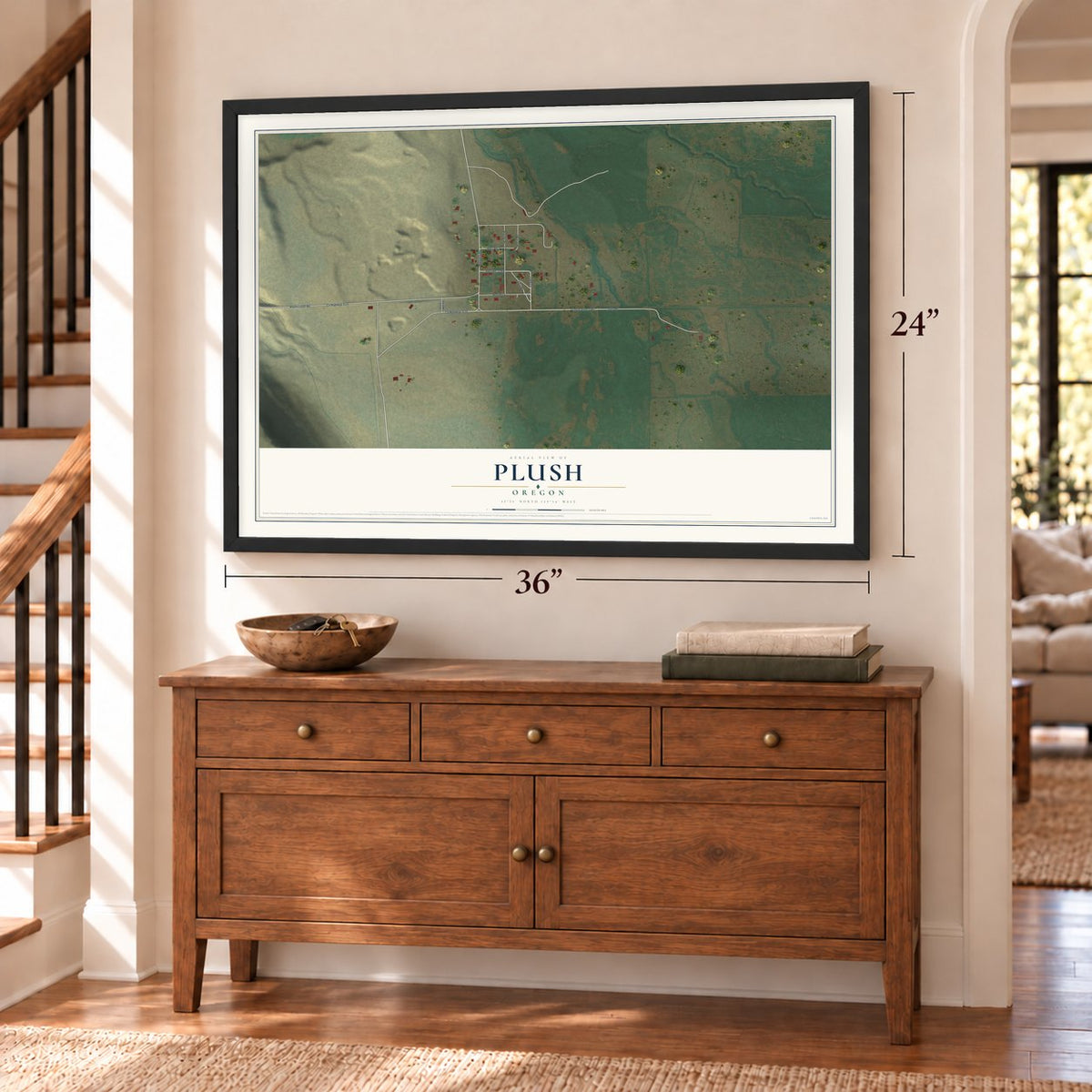 Plush, Oregon map, 24 x 36 inch print in a black frame above a dresser by a staircase