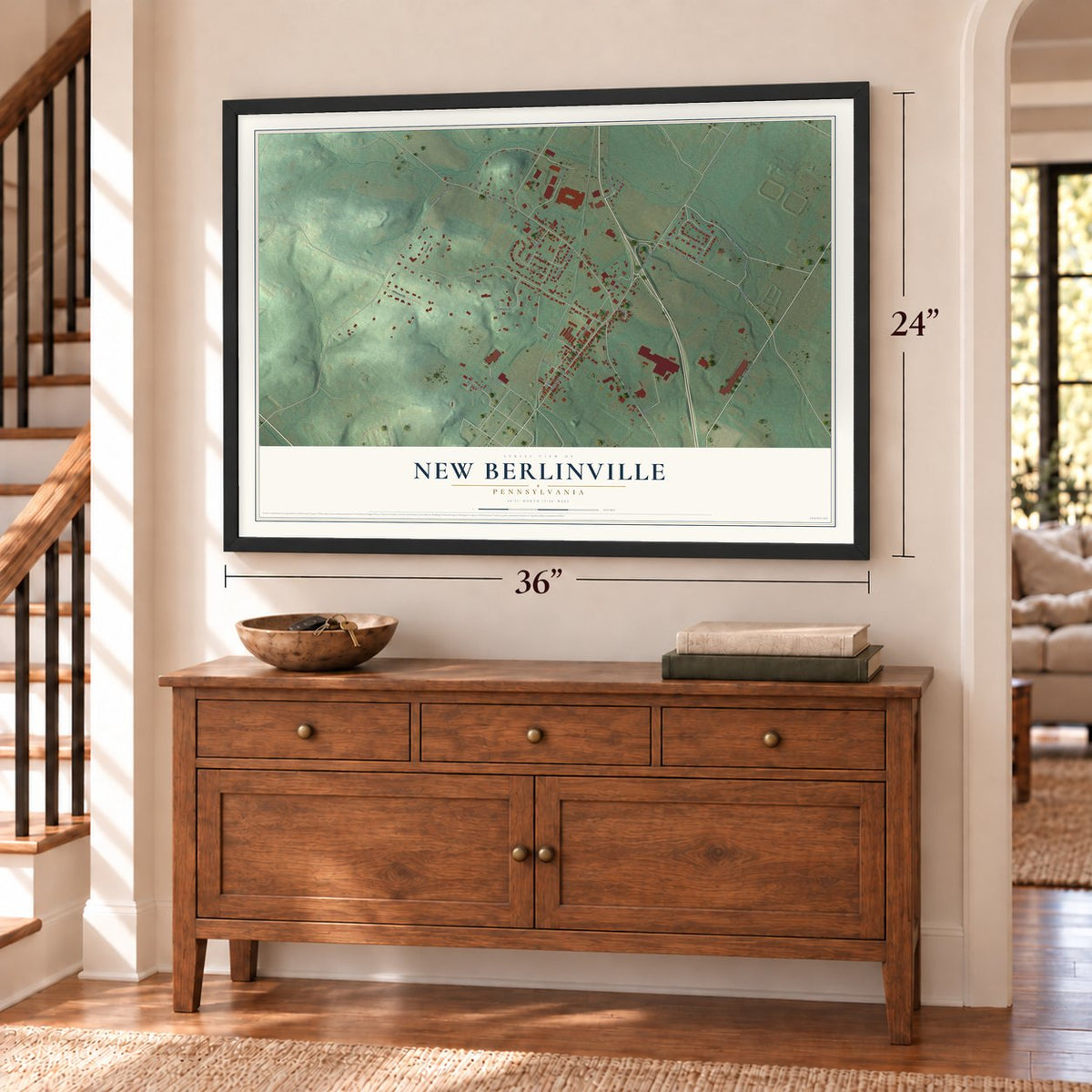 New Berlinville, Pennsylvania map, 24 x 36 inch print in a black frame above a dresser by a staircase