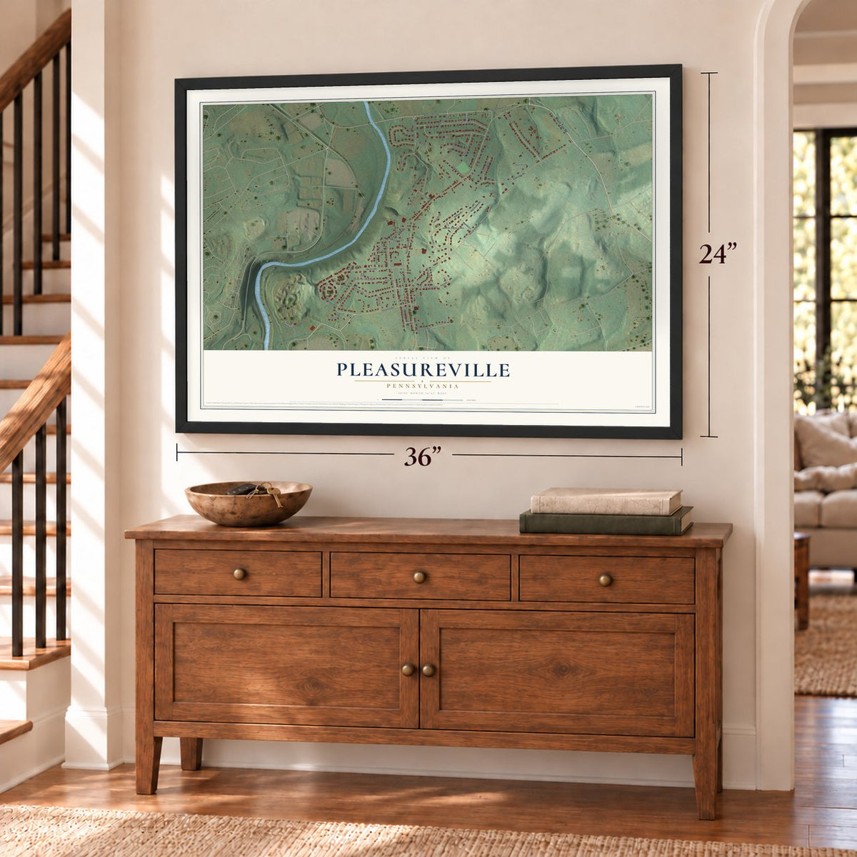 Pleasureville, Pennsylvania map, 24 x 36 inch print in a black frame above a dresser by a staircase