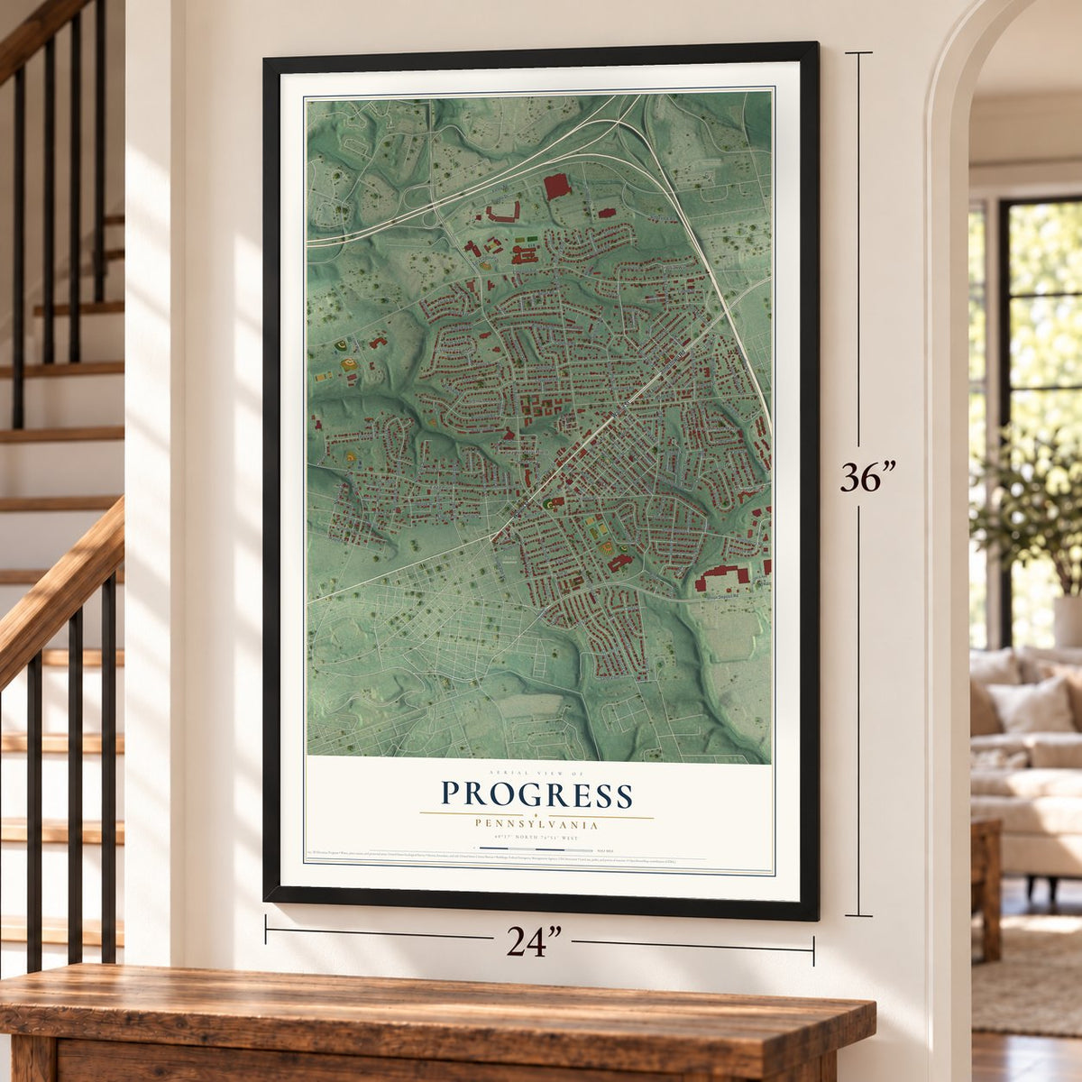 Progress, Pennsylvania map, 24 x 36 inch print in a black frame by a staircase