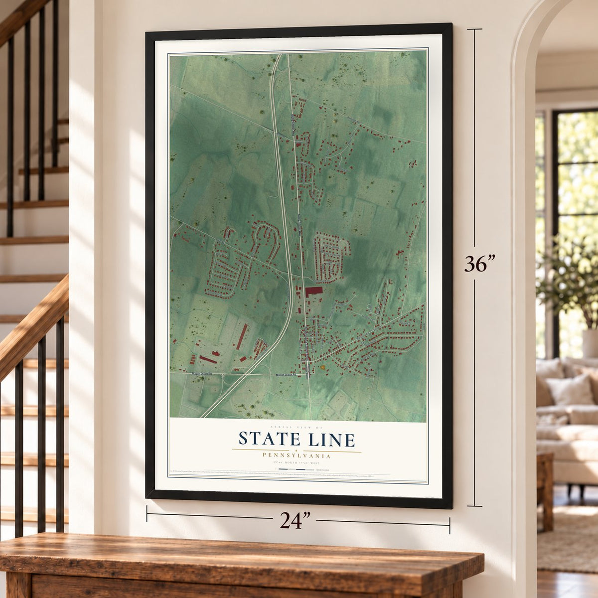 State Line, Pennsylvania map, 24 x 36 inch print in a black frame by a staircase