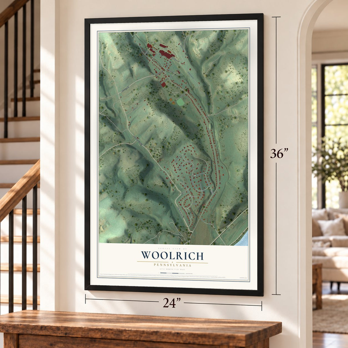 Woolrich, Pennsylvania map, 24 x 36 inch print in a black frame by a staircase