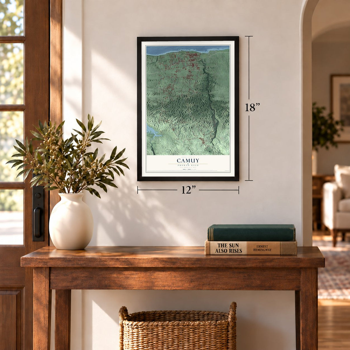 Camuy, Puerto Rico map, 12 x 18 inch print in a black frame in an entryway
