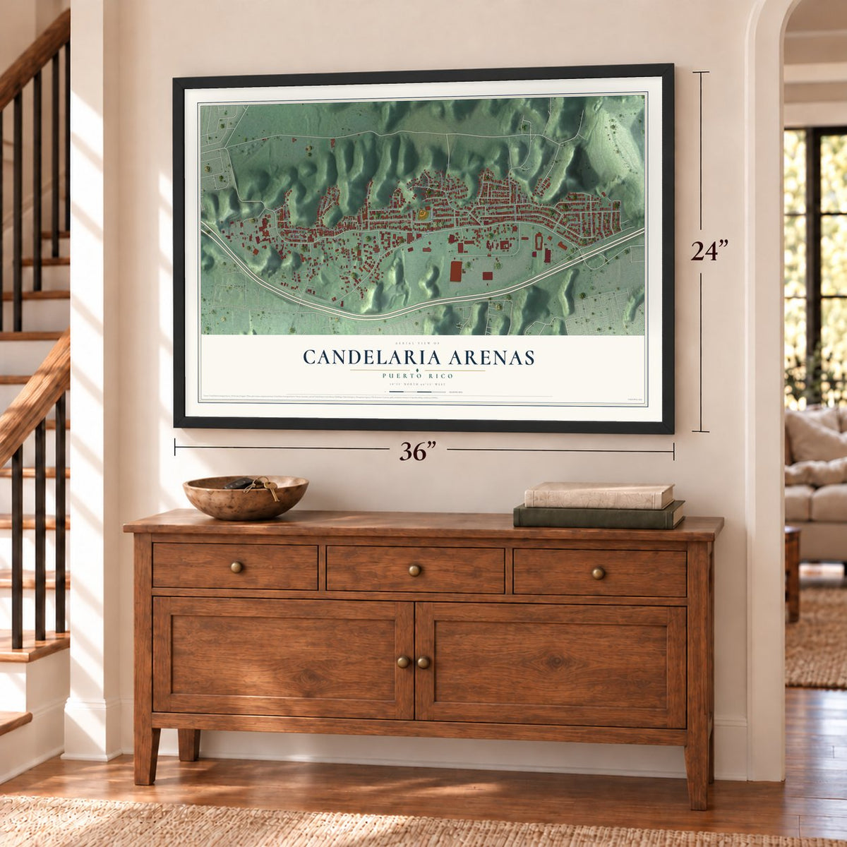 Candelaria Arenas, Puerto Rico map, 24 x 36 inch print in a black frame above a dresser by a staircase