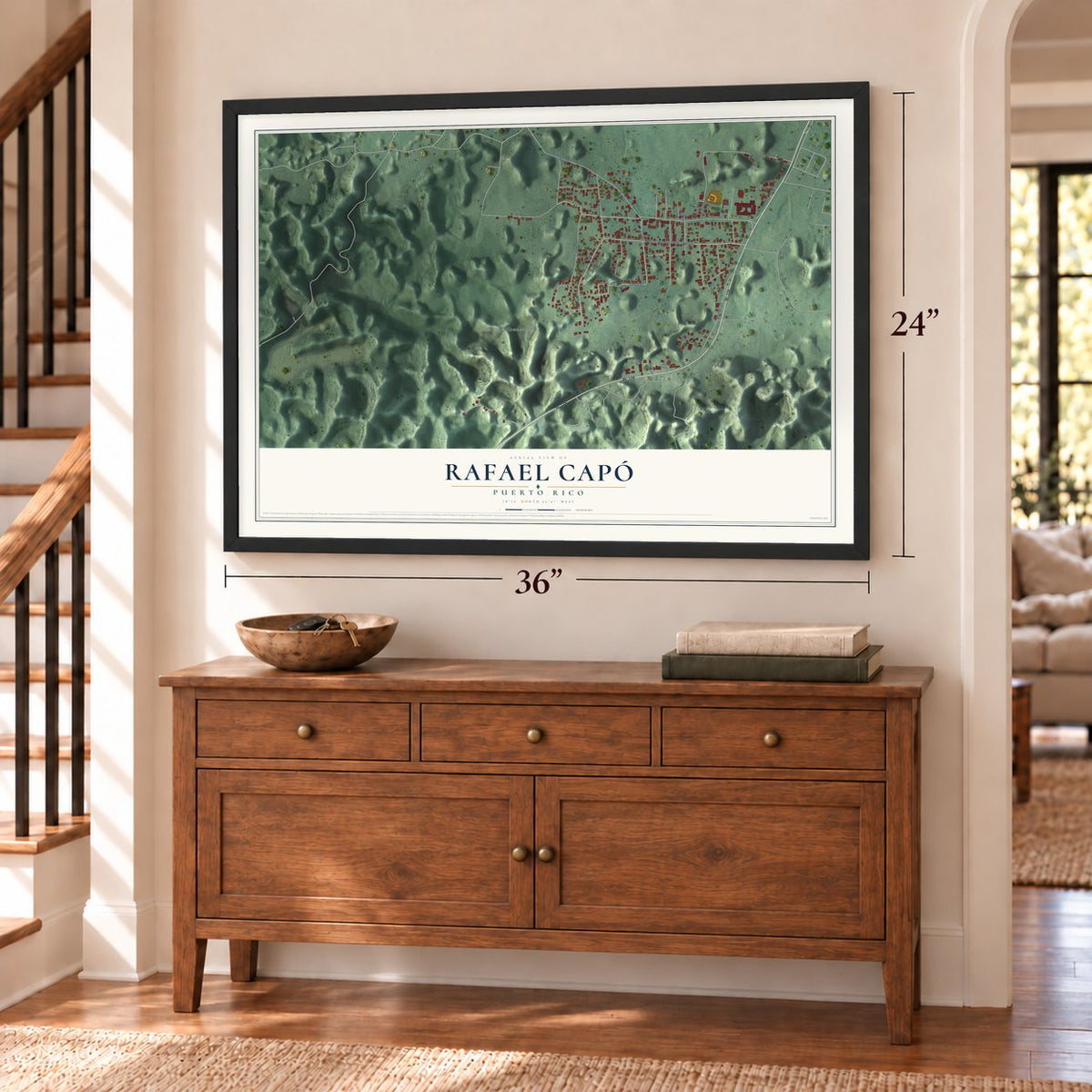 Rafael Capó, Puerto Rico map, 24 x 36 inch print in a black frame above a dresser by a staircase
