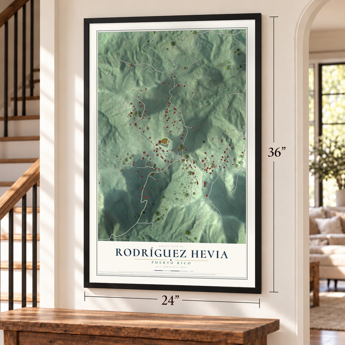 Rodríguez Hevia, Puerto Rico map, 24 x 36 inch print in a black frame by a staircase