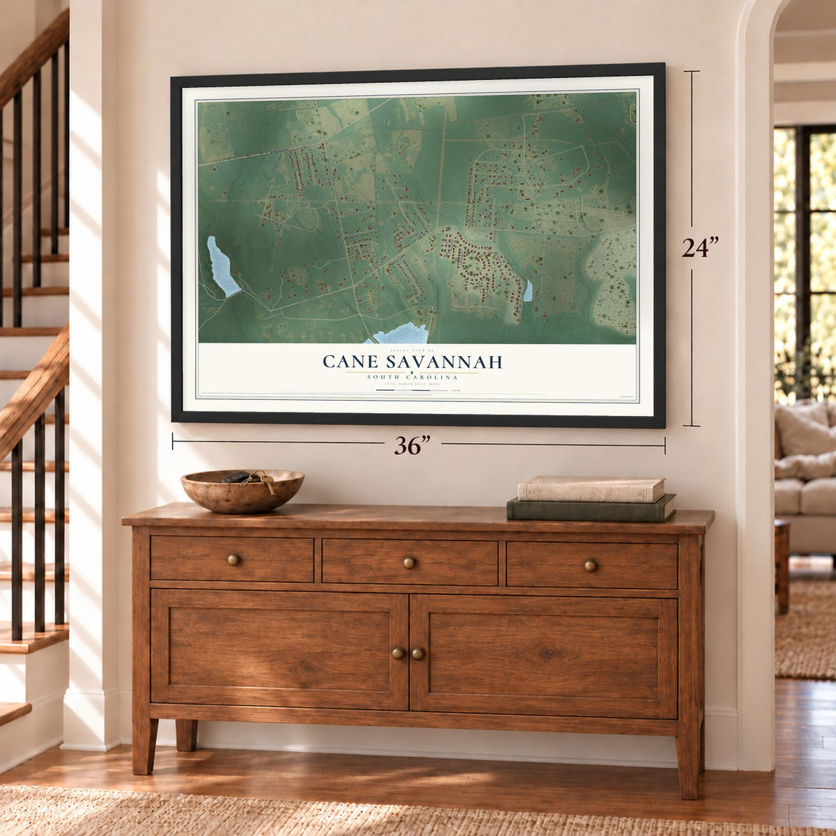 Cane Savannah, South Carolina map, 24 x 36 inch print in a black frame above a dresser by a staircase