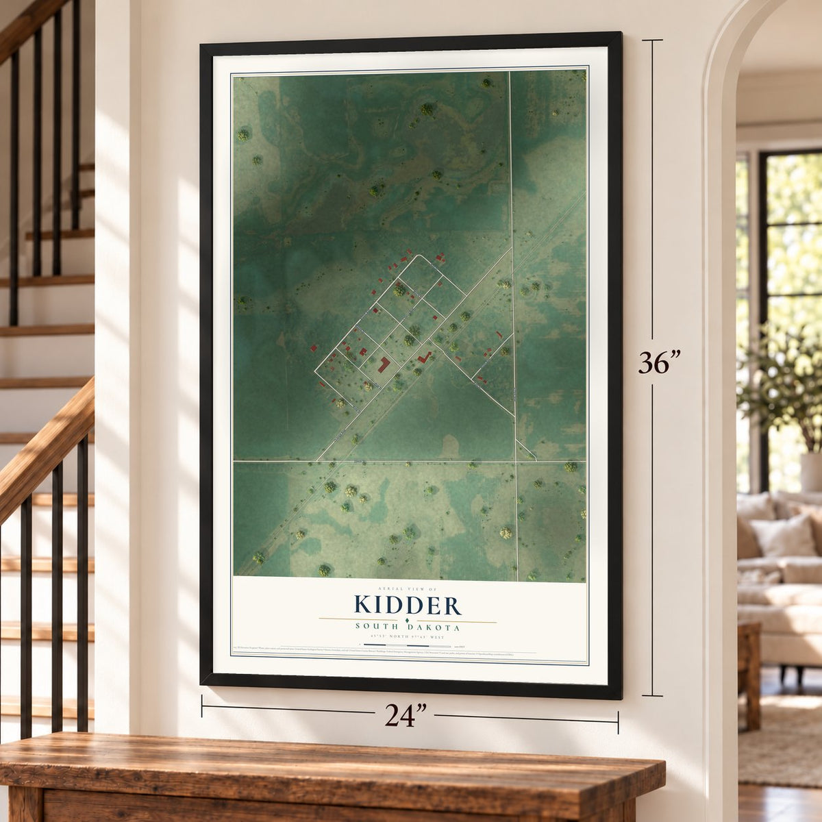 Kidder, South Dakota map, 24 x 36 inch print in a black frame by a staircase