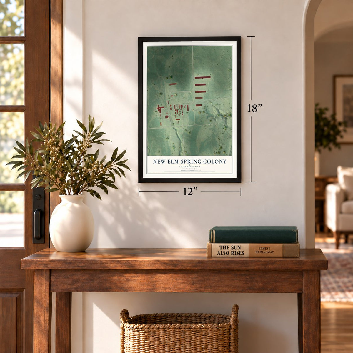New Elm Spring Colony, South Dakota map, 12 x 18 inch print in a black frame in an entryway