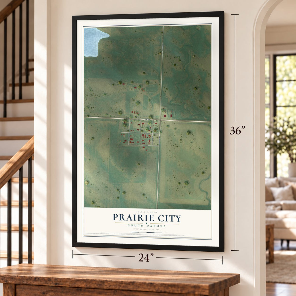Prairie City, South Dakota map, 24 x 36 inch print in a black frame by a staircase