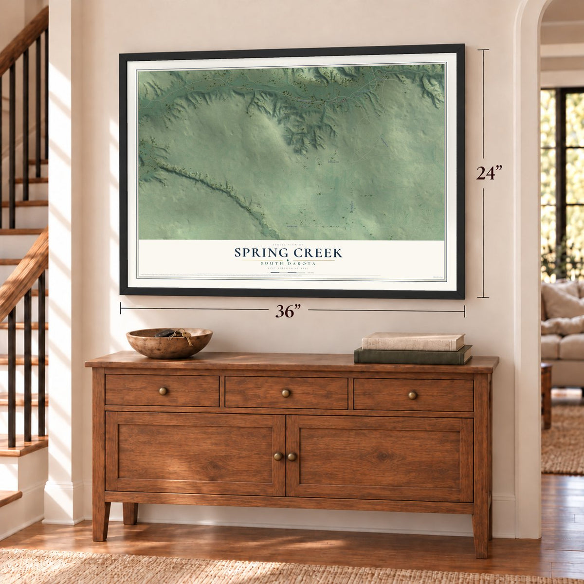 Spring Creek, South Dakota map, 24 x 36 inch print in a black frame above a dresser by a staircase