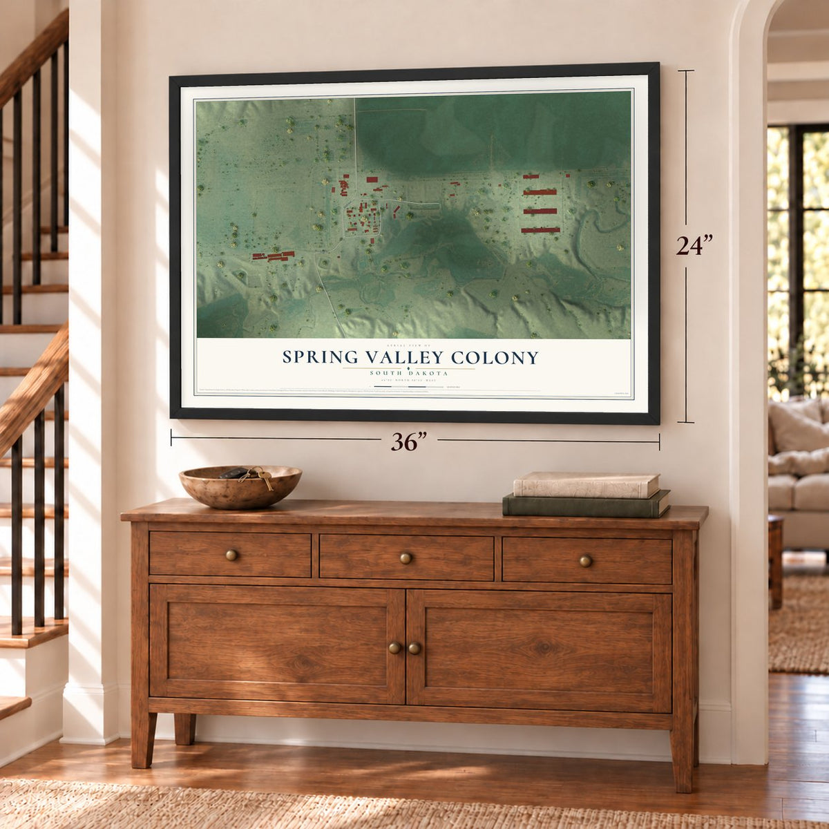 Spring Valley Colony, South Dakota map, 24 x 36 inch print in a black frame above a dresser by a staircase