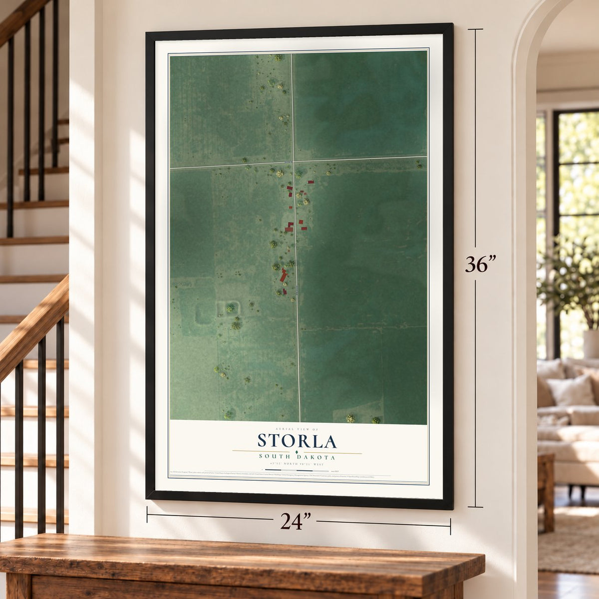 Storla, South Dakota map, 24 x 36 inch print in a black frame by a staircase