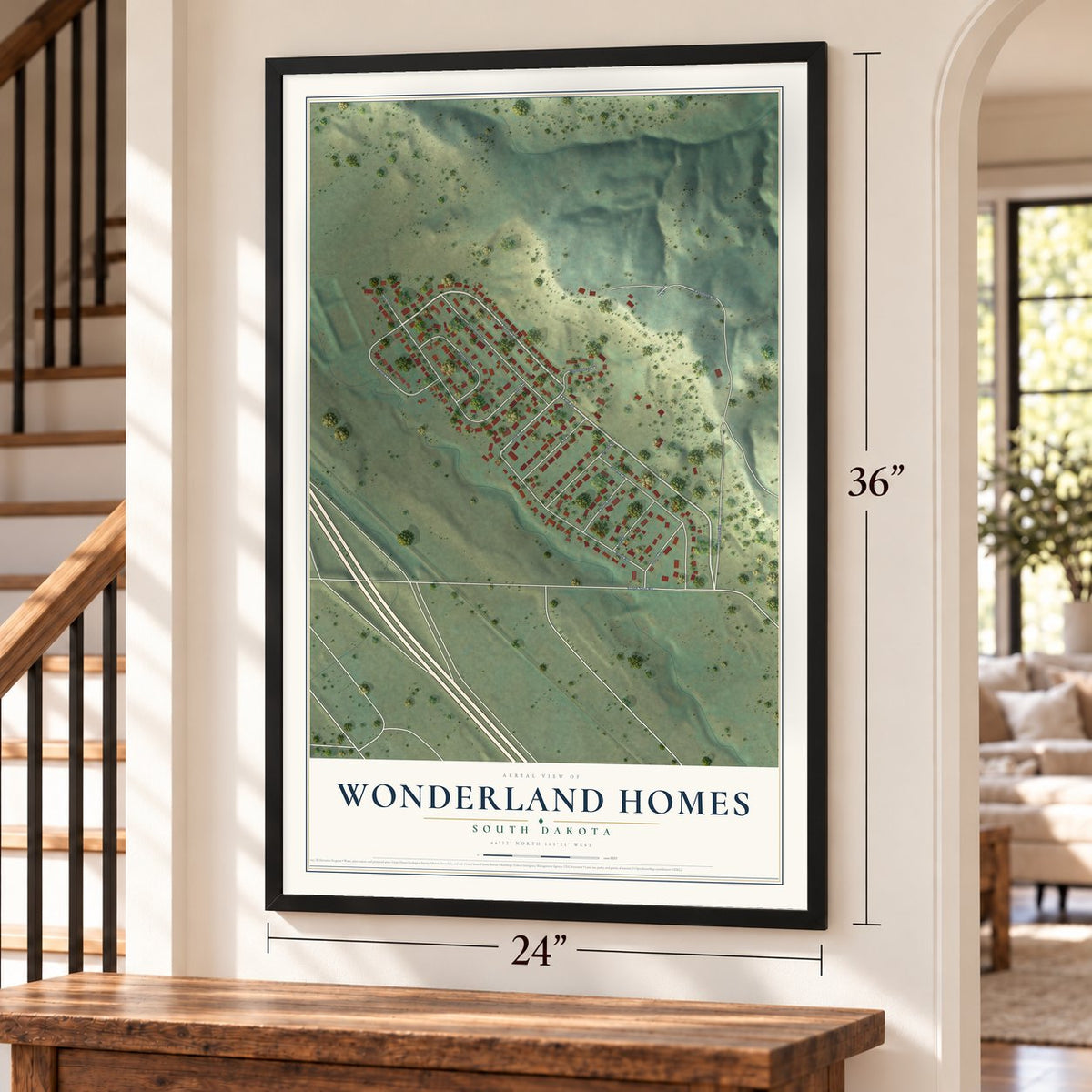Wonderland Homes, South Dakota map, 24 x 36 inch print in a black frame by a staircase