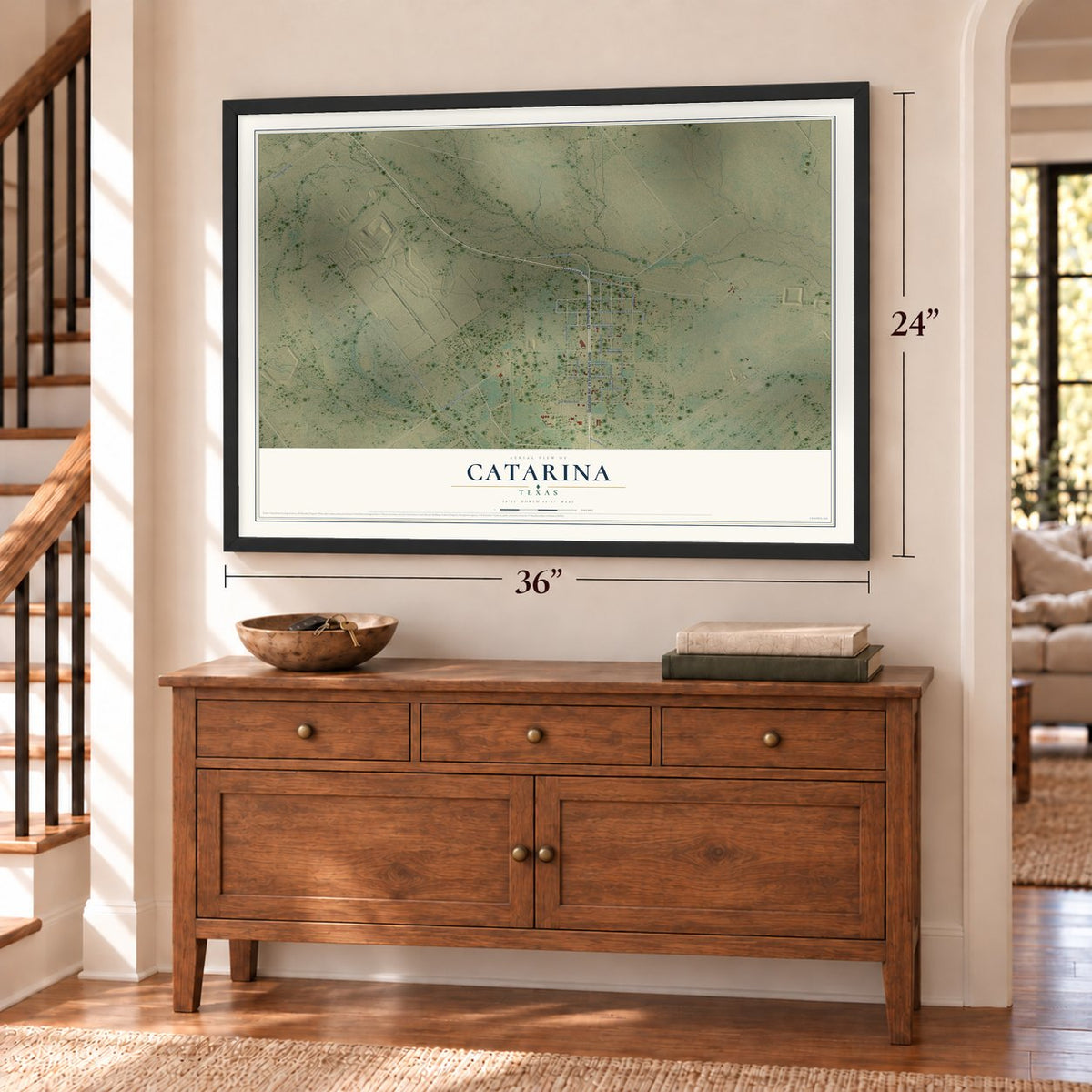 Catarina, Texas map, 24 x 36 inch print in a black frame above a dresser by a staircase