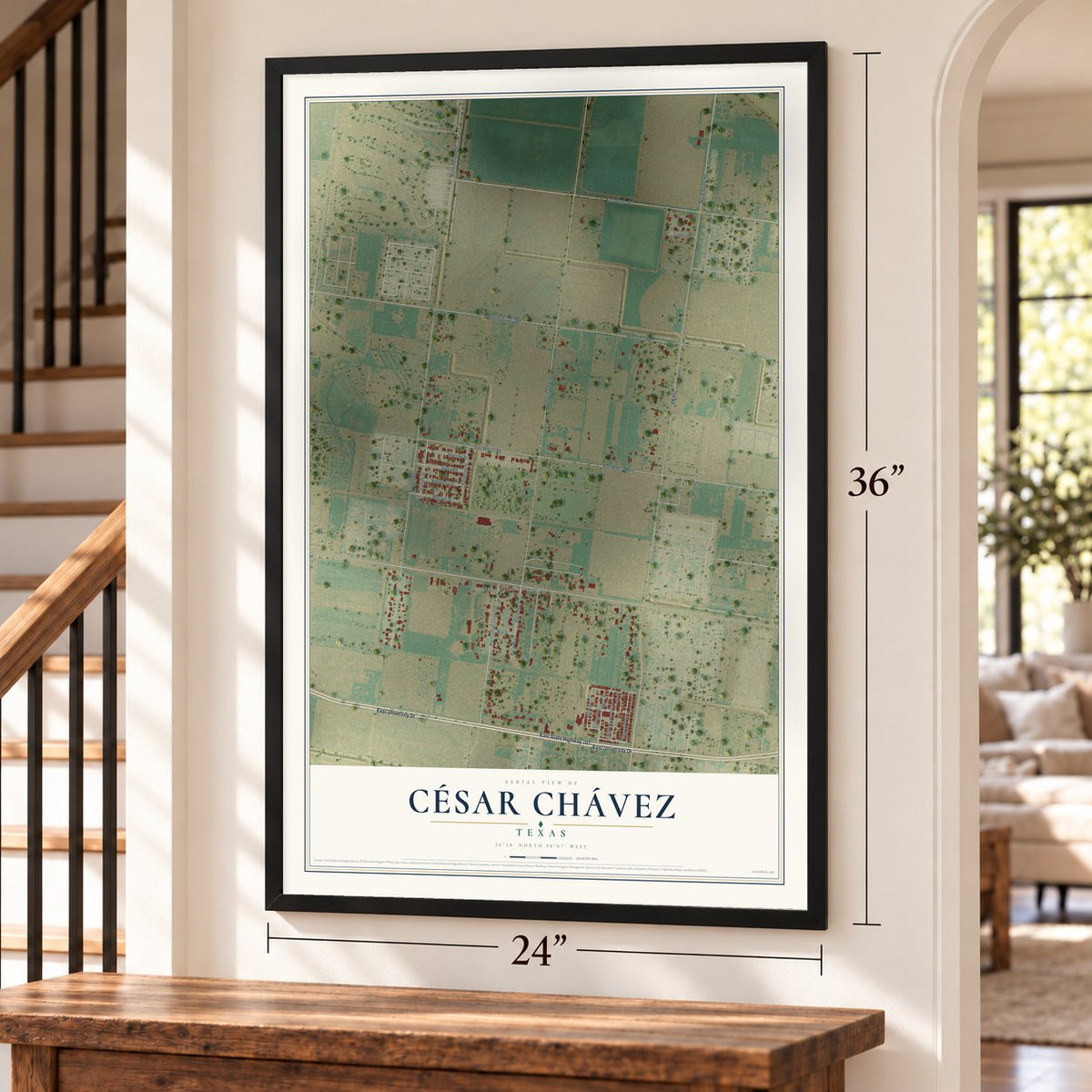 César Chávez, Texas map, 24 x 36 inch print in a black frame by a staircase