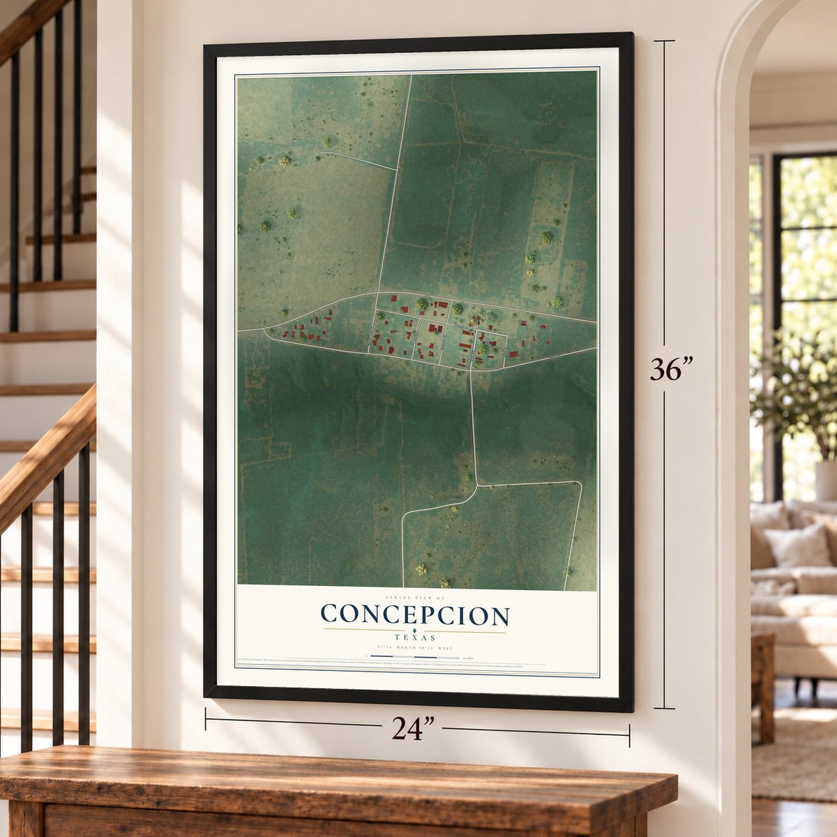 Concepcion, Texas map, 24 x 36 inch print in a black frame by a staircase