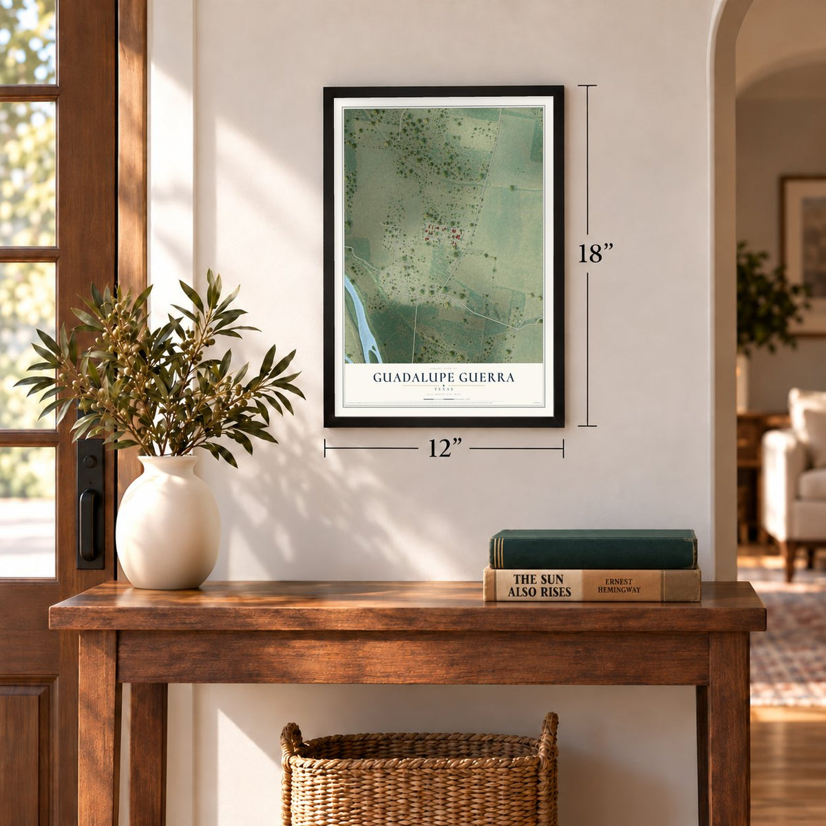 Guadalupe Guerra, Texas map, 12 x 18 inch print in a black frame in an entryway