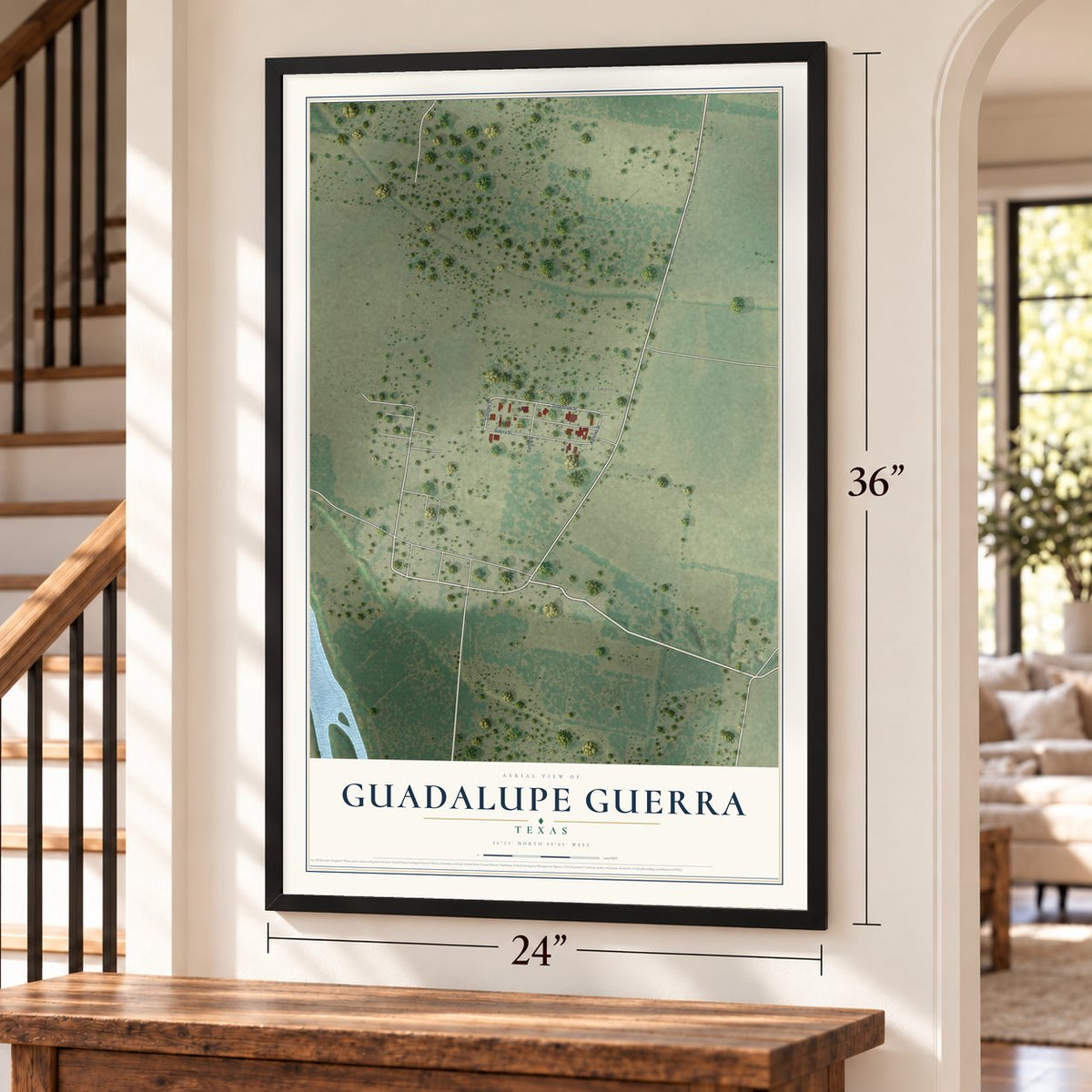 Guadalupe Guerra, Texas map, 24 x 36 inch print in a black frame by a staircase