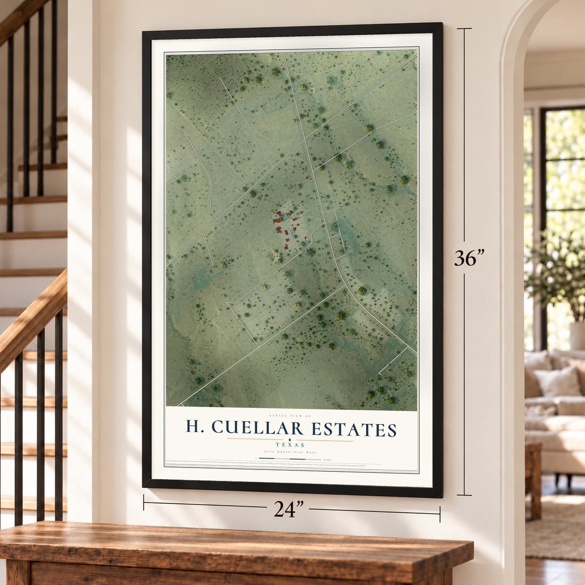 H. Cuellar Estates, Texas map, 24 x 36 inch print in a black frame by a staircase