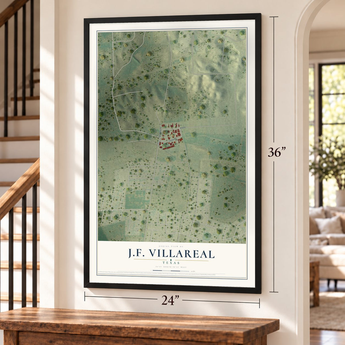J.F. Villareal, Texas map, 24 x 36 inch print in a black frame by a staircase