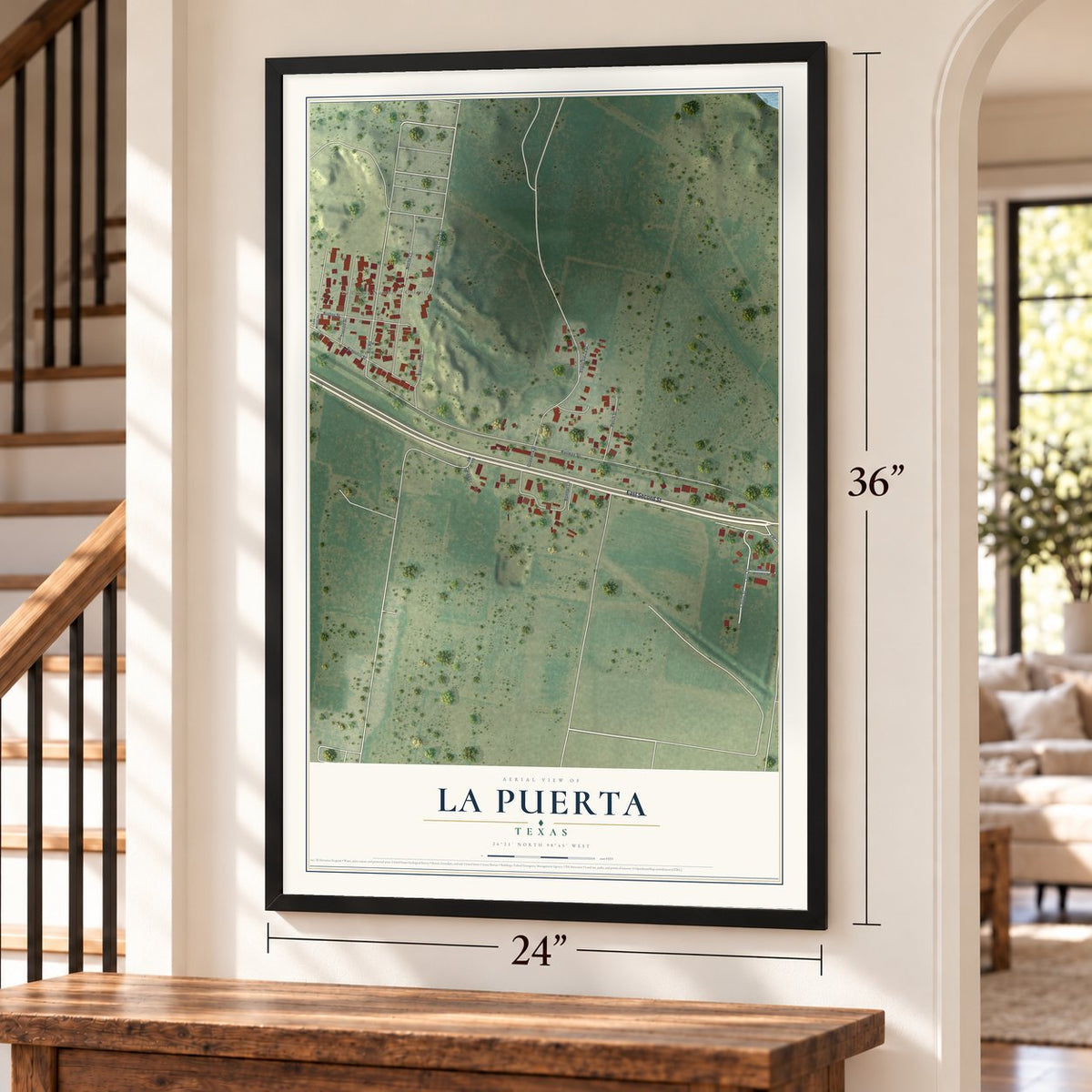 La Puerta, Texas map, 24 x 36 inch print in a black frame by a staircase
