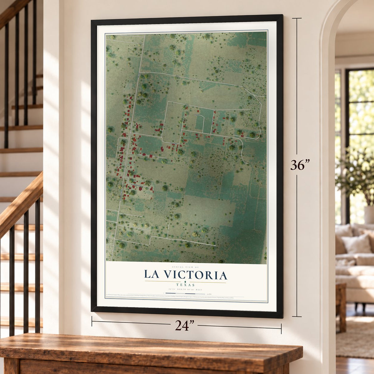 La Victoria, Texas map, 24 x 36 inch print in a black frame by a staircase