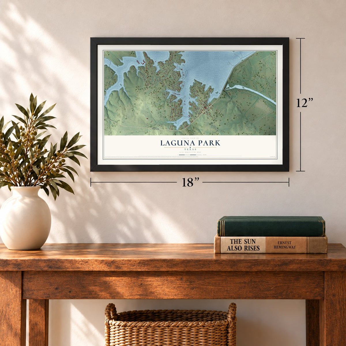 Laguna Park, Texas map, 12 x 18 inch print in a black frame in an entryway