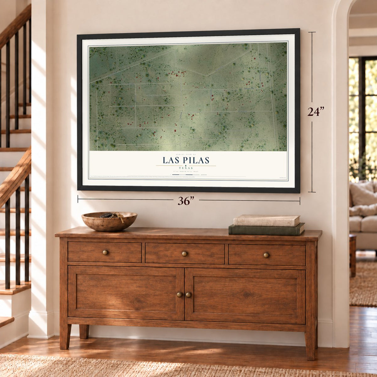 Las Pilas, Texas map, 24 x 36 inch print in a black frame above a dresser by a staircase