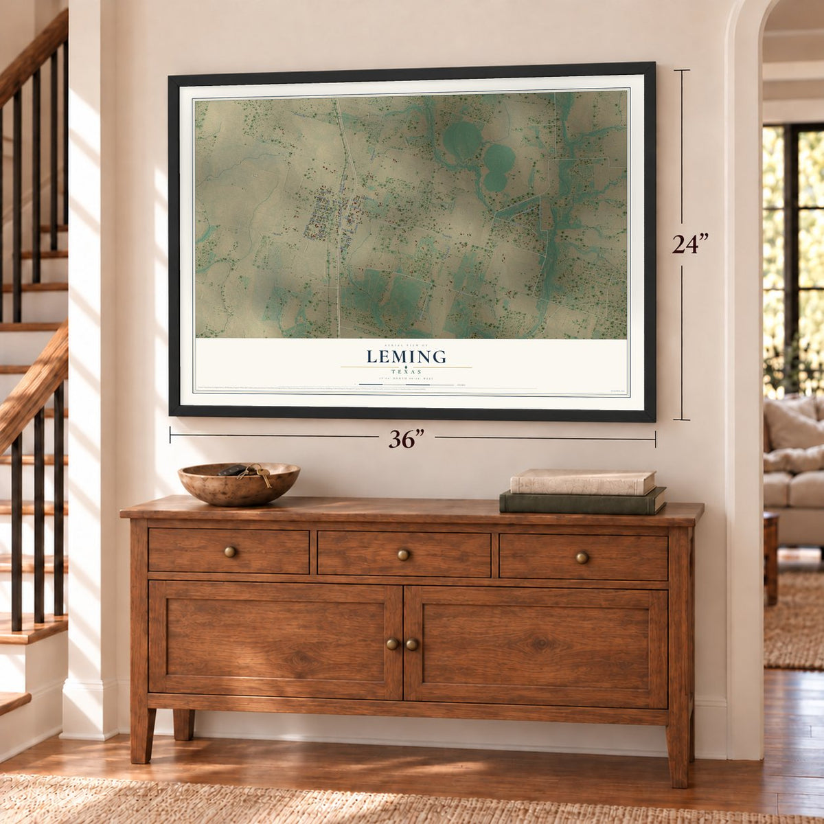 Leming, Texas map, 24 x 36 inch print in a black frame above a dresser by a staircase