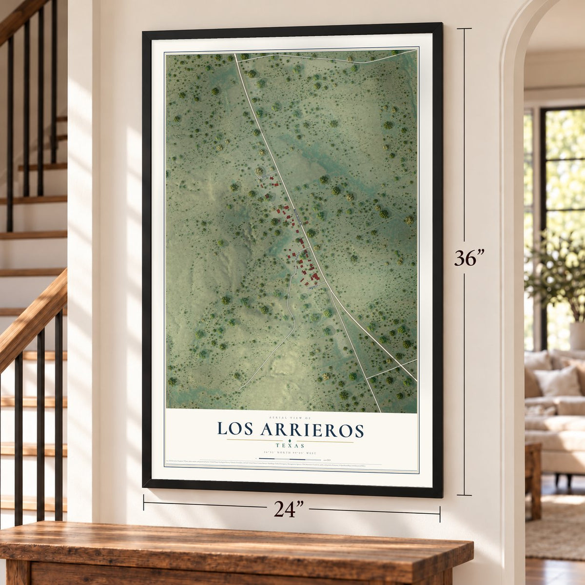 Los Arrieros, Texas map, 24 x 36 inch print in a black frame by a staircase