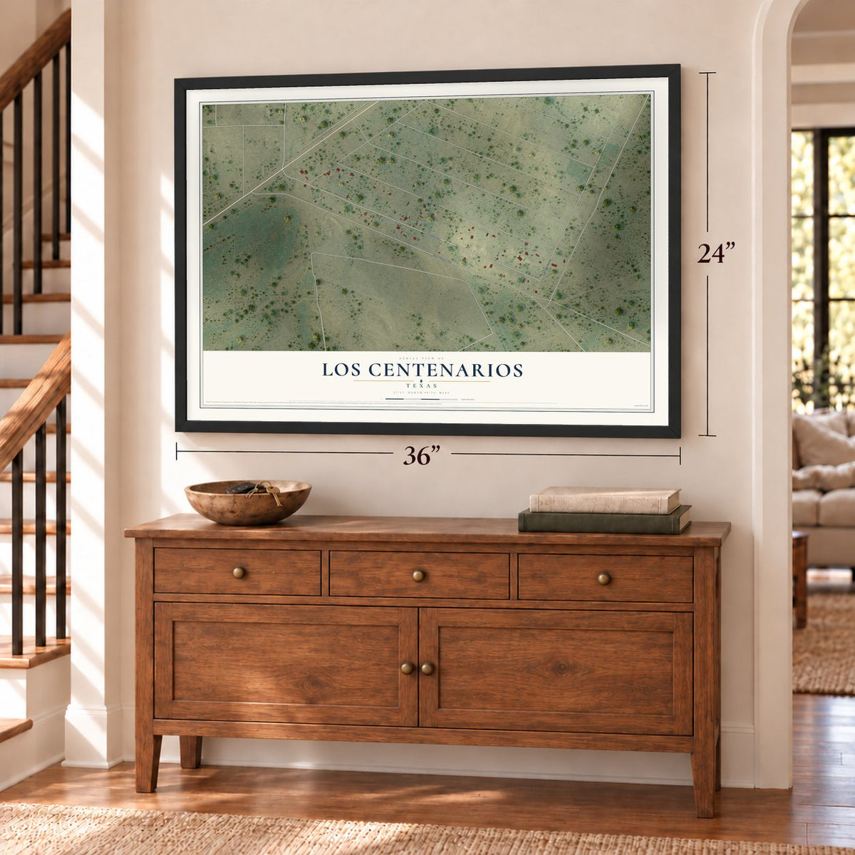 Los Centenarios, Texas map, 24 x 36 inch print in a black frame above a dresser by a staircase
