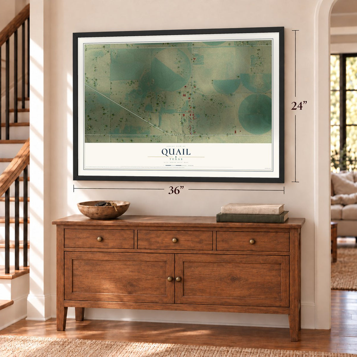 Quail, Texas map, 24 x 36 inch print in a black frame above a dresser by a staircase