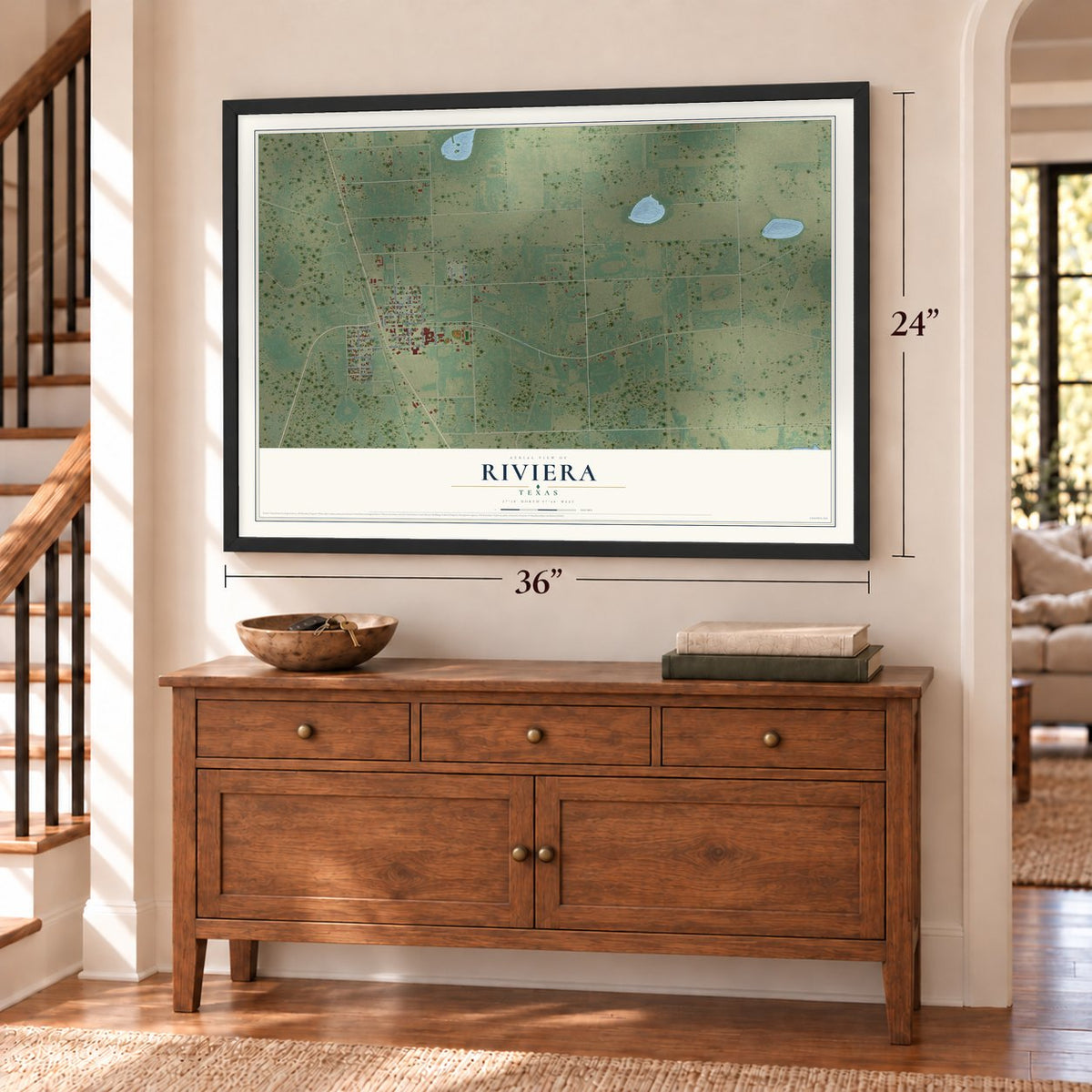 Riviera, Texas map, 24 x 36 inch print in a black frame above a dresser by a staircase
