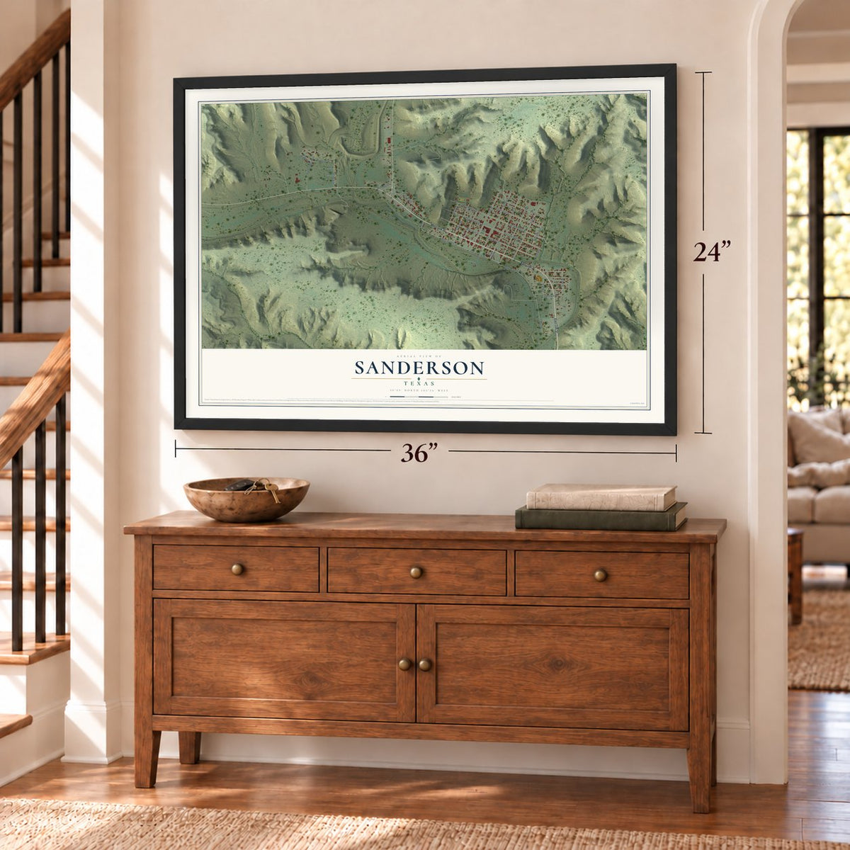 Sanderson, Texas map, 24 x 36 inch print in a black frame above a dresser by a staircase