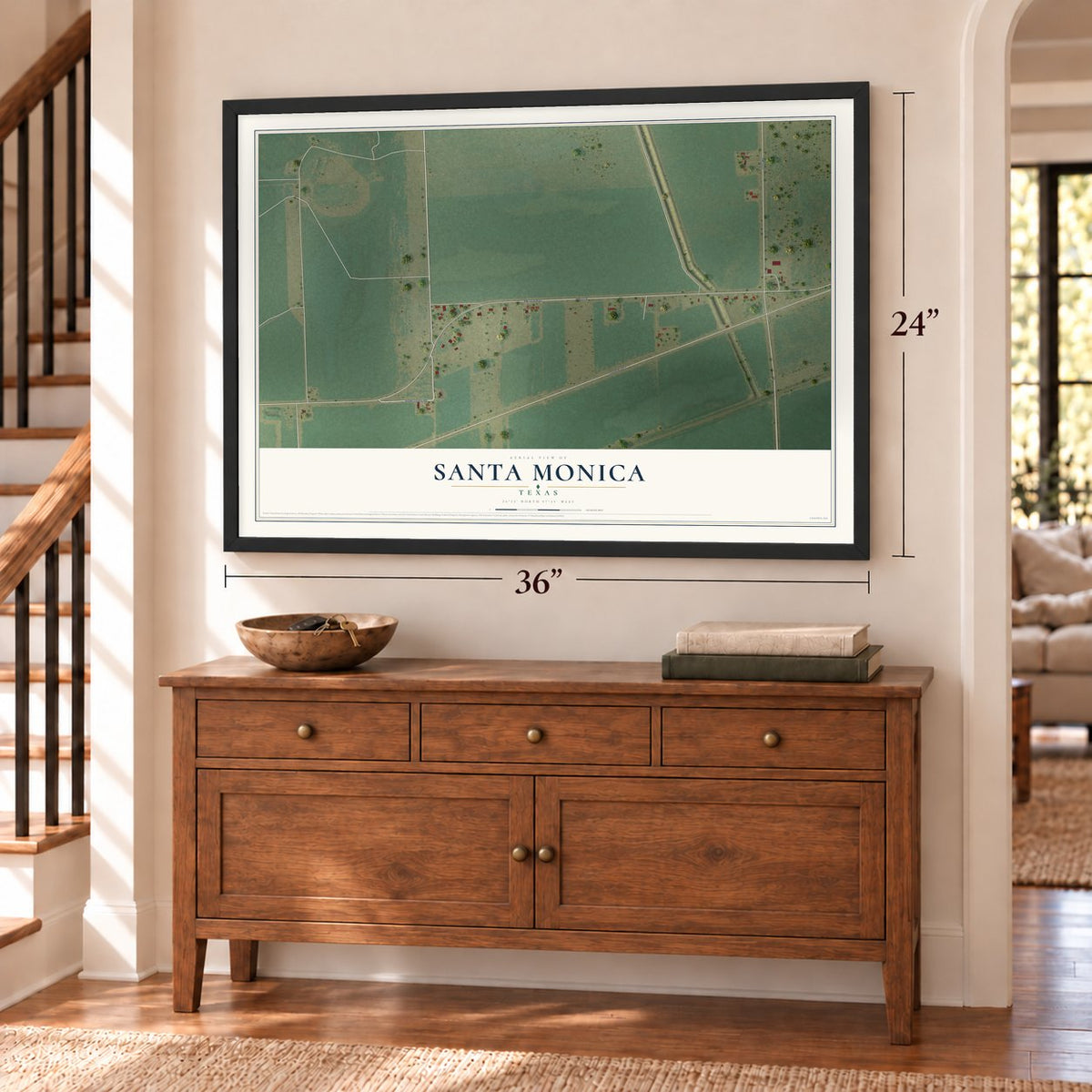 Santa Monica, Texas map, 24 x 36 inch print in a black frame above a dresser by a staircase