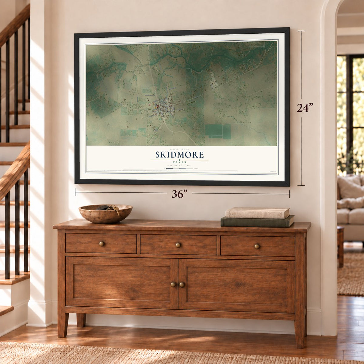 Skidmore, Texas map, 24 x 36 inch print in a black frame above a dresser by a staircase