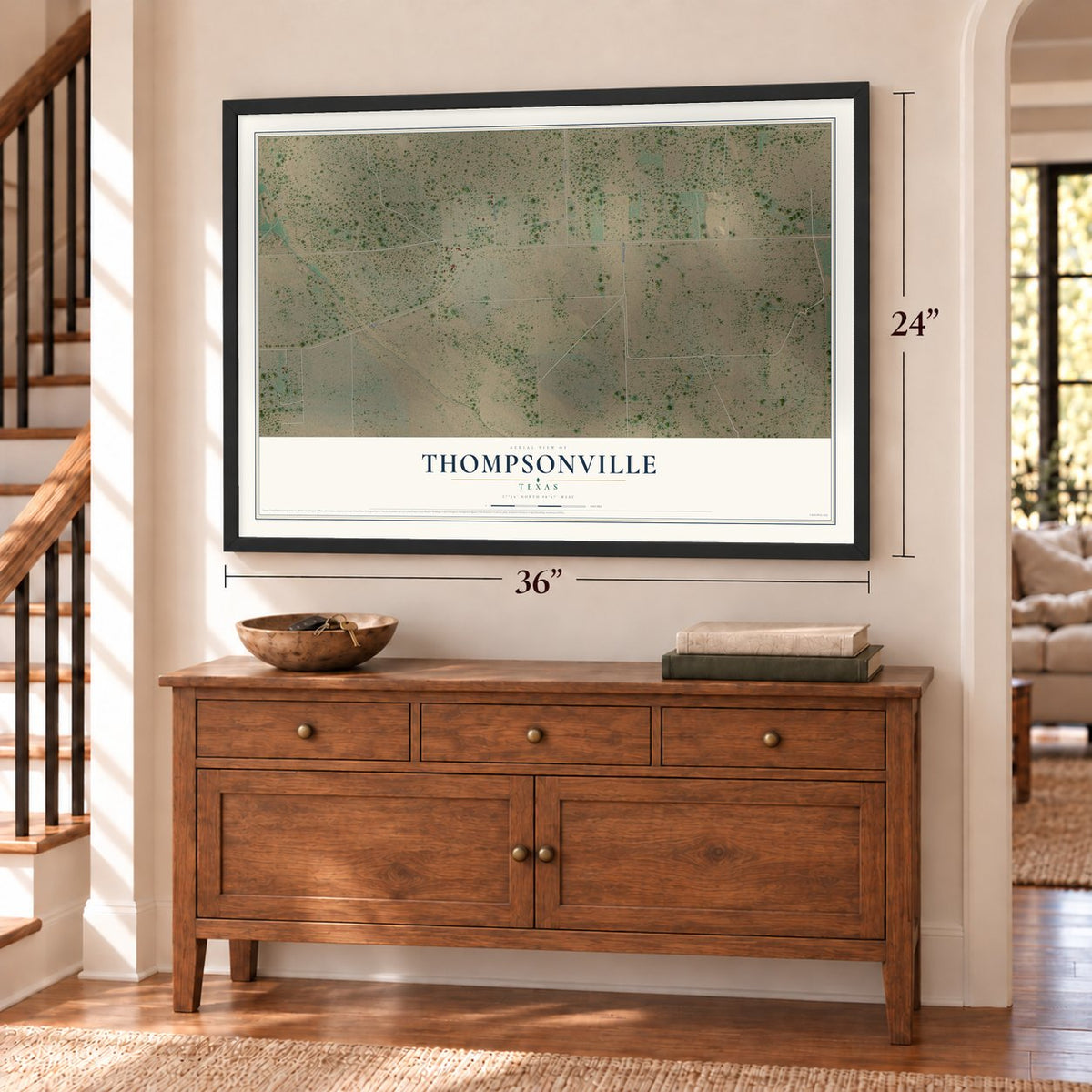 Thompsonville, Texas map, 24 x 36 inch print in a black frame above a dresser by a staircase