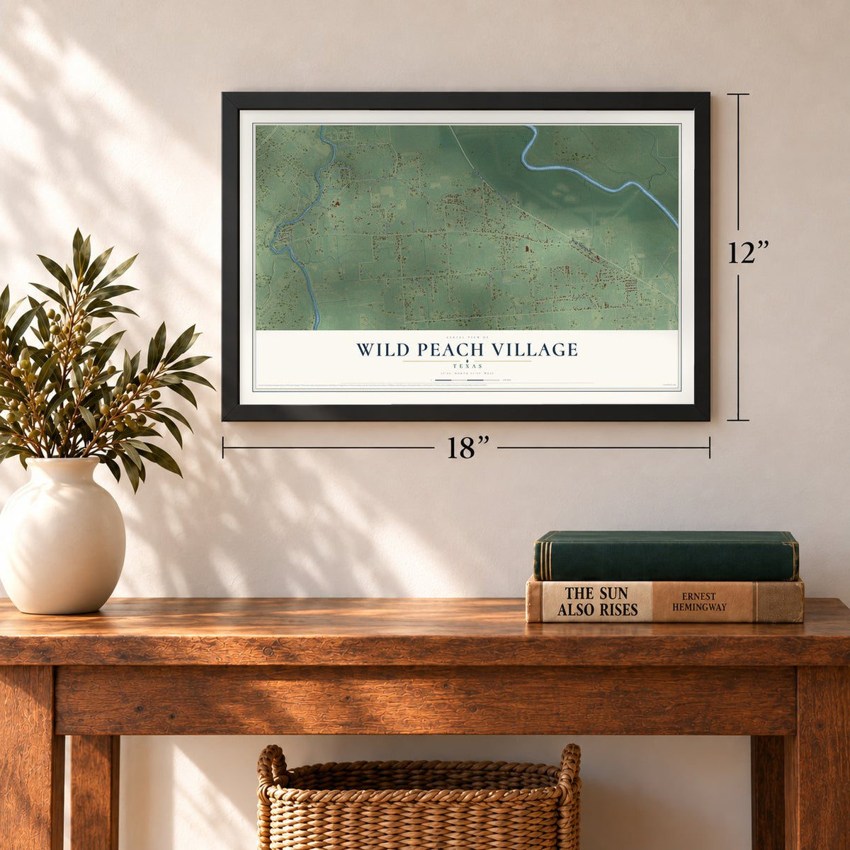 Wild Peach Village, Texas map, 12 x 18 inch print in a black frame in an entryway