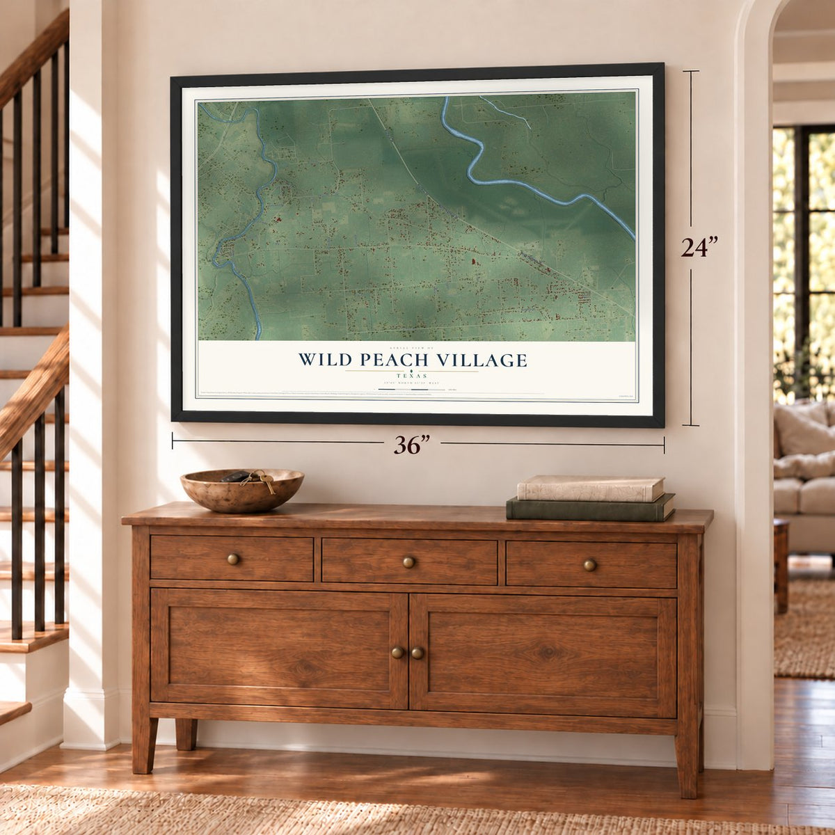 Wild Peach Village, Texas map, 24 x 36 inch print in a black frame above a dresser by a staircase