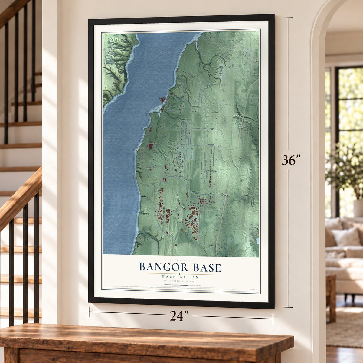 Bangor Base, Washington map, 24 x 36 inch print in a black frame by a staircase