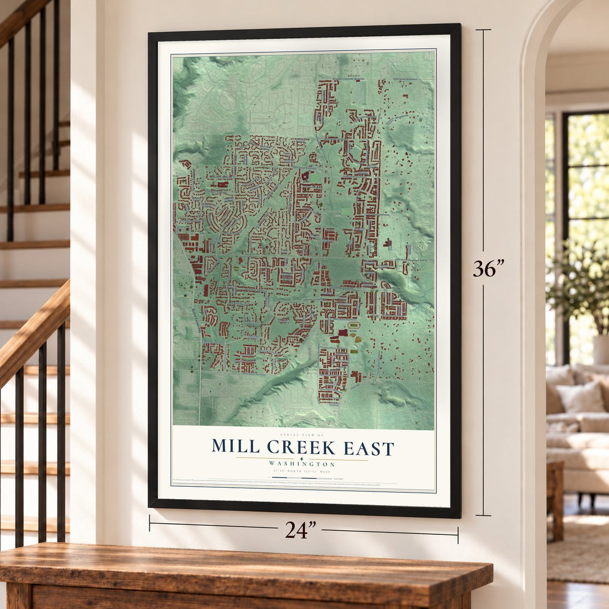 Mill Creek East, Washington map, 24 x 36 inch print in a black frame by a staircase
