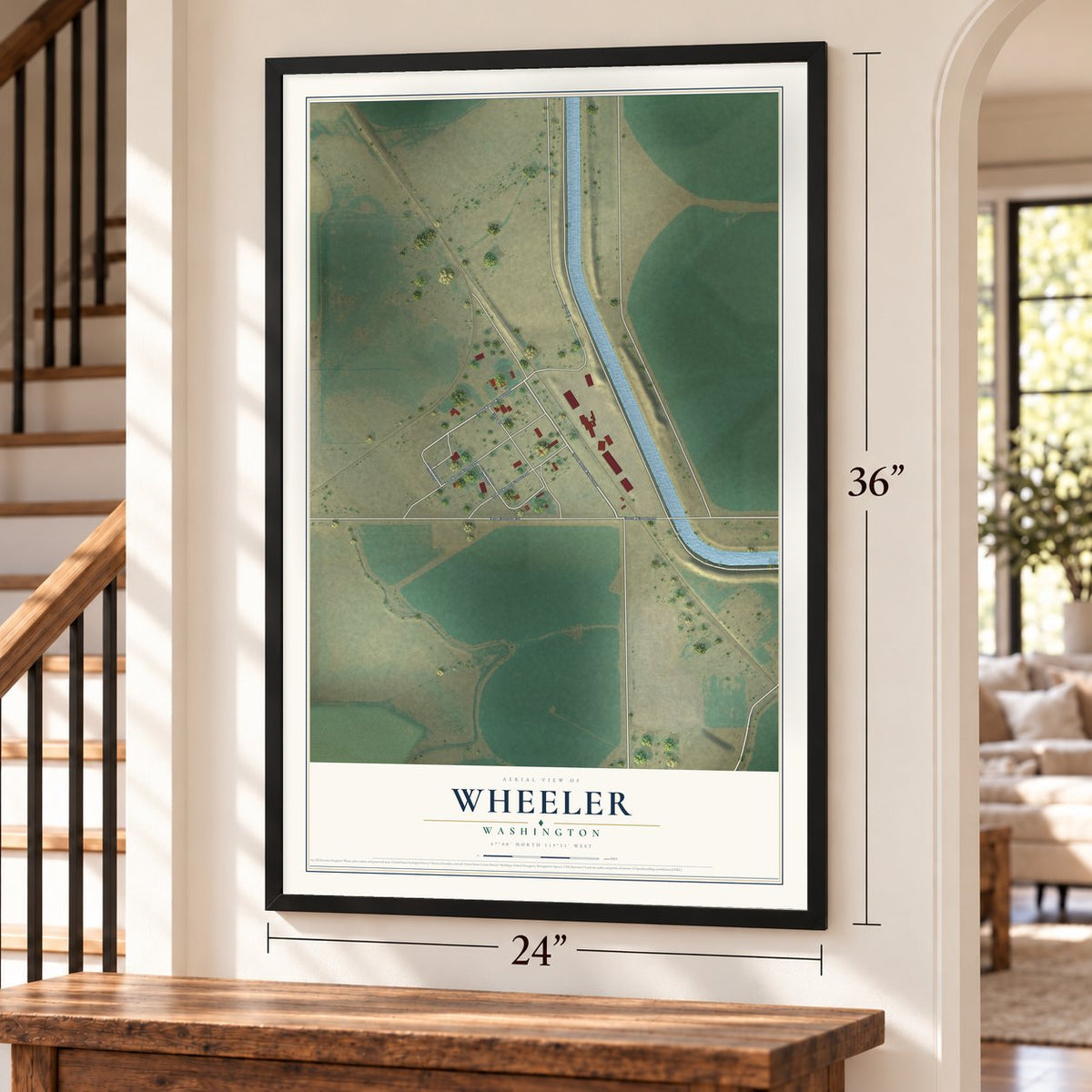 Wheeler, Washington map, 24 x 36 inch print in a black frame by a staircase